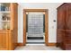 Elegant bathroom doorway featuring glass block accents and wood trim at 6600 Maynard Farm Rd, Chapel Hill, NC 27516