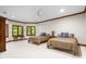 Spacious bedroom with two twin beds, wood trim and natural light at 6600 Maynard Farm Rd, Chapel Hill, NC 27516