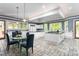 Bright and airy kitchen with white cabinets, black countertops, and unique tile flooring at 6600 Maynard Farm Rd, Chapel Hill, NC 27516