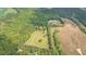 Aerial view of the property highlighting acreage, pastures, and proximity to woodlands at 6600(A) Maynard Farm Rd, Chapel Hill, NC 27516