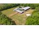 Aerial view of the horse farm, featuring barns, riding arena, and lush green pastures at 6600(A) Maynard Farm Rd, Chapel Hill, NC 27516