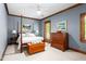 Cozy bedroom with four-poster bed, wood trim, and ample natural light at 6600(A) Maynard Farm Rd, Chapel Hill, NC 27516
