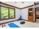 Versatile bonus room with large window, TV, and exercise equipment at 6600(A) Maynard Farm Rd, Chapel Hill, NC 27516