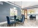 Bright dining area with a glass table and plush blue chairs, perfect for Gathering meals at 6600(A) Maynard Farm Rd, Chapel Hill, NC 27516