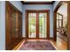 Grand foyer with hardwood floors, beautiful french doors, and custom millwork at 6600(A) Maynard Farm Rd, Chapel Hill, NC 27516