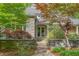 Stone clad home with a gated courtyard leading to the double door front entrance at 6600(A) Maynard Farm Rd, Chapel Hill, NC 27516