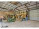Spacious garage with high ceilings, storage loft, and equipment for property maintenance at 6600(A) Maynard Farm Rd, Chapel Hill, NC 27516