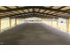 Spacious indoor riding arena featuring metal beams and well-maintained grounds at 6600(A) Maynard Farm Rd, Chapel Hill, NC 27516