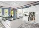 Elegant kitchen features an island cooktop and modern white cabinets, offering ample storage at 6600(A) Maynard Farm Rd, Chapel Hill, NC 27516