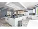 Modern kitchen with sleek white cabinets, stainless steel appliances, and center island at 6600(A) Maynard Farm Rd, Chapel Hill, NC 27516