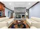 Living room boasts stone fireplace, hardwood floors, custom trim, and natural light at 6600(A) Maynard Farm Rd, Chapel Hill, NC 27516