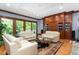 Cozy living room featuring built-in bookshelves, hardwood floors, and natural light at 6600(A) Maynard Farm Rd, Chapel Hill, NC 27516