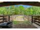 Pasture view from the horse barn with black wheelbarrow at 6600(A) Maynard Farm Rd, Chapel Hill, NC 27516