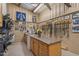View of the tack room with cabinets, sink, and photos at 6600(A) Maynard Farm Rd, Chapel Hill, NC 27516