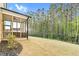 Spacious backyard with screened porch, manicured lawn, and privacy fence at 67 Comfort Ct, Fuquay Varina, NC 27526
