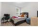 Comfortable bedroom setup with cozy bed, desk, and soft textures for relaxation at 67 Comfort Ct, Fuquay Varina, NC 27526