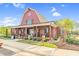 Inviting clubhouse featuring a covered porch with rocking chairs, perfect for relaxing and enjoying community views at 67 Comfort Ct, Fuquay Varina, NC 27526