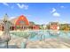 Resort-style community pool with lounge chairs and umbrellas, offering a refreshing escape for residents at 67 Comfort Ct, Fuquay Varina, NC 27526