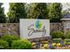 An eye-catching community sign framed with colorful plantings makes a great first impression at 67 Comfort Ct, Fuquay Varina, NC 27526