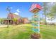 The Barnyard community sign shows directions to community features such as Serenity Hall, and the Swimming Hole at 67 Comfort Ct, Fuquay Varina, NC 27526