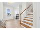 Inviting entryway with hardwood floors, stairs, and a front door at 67 Comfort Ct, Fuquay Varina, NC 27526