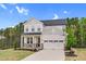 Beautiful home with a two-car garage, a basketball hoop, and a well-maintained front lawn at 67 Comfort Ct, Fuquay Varina, NC 27526