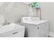 Well-equipped laundry room with utility sink and white washer-dryer set for convenience at 67 Comfort Ct, Fuquay Varina, NC 27526