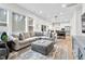 Open-concept living room and dining area with ample natural light and modern finishes at 67 Comfort Ct, Fuquay Varina, NC 27526