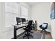 Comfortable office space with a computer setup, a work chair and accent chair, plus natural light at 67 Comfort Ct, Fuquay Varina, NC 27526