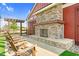Beautiful outdoor stone fireplace and seating enhance the sense of community at this property at 67 Comfort Ct, Fuquay Varina, NC 27526