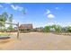 Playground with windmill, swings and a slide surrounded by beautiful landscaping and Gathering friendly ammenities at 67 Comfort Ct, Fuquay Varina, NC 27526