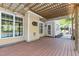 Cozy back deck featuring a pergola, wooden flooring, and views of the surrounding backyard at 6925 Rex Rd, Holly Springs, NC 27540