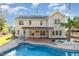 Large backyard featuring a pool, a deck, and well-maintained landscaping for outdoor enjoyment at 6925 Rex Rd, Holly Springs, NC 27540