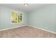 This bedroom has beautiful natural light at 6925 Rex Rd, Holly Springs, NC 27540