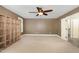 Bedroom featuring neutral walls and carpet, a ceiling fan, and natural light at 6925 Rex Rd, Holly Springs, NC 27540