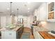 Spacious kitchen features granite countertops, stainless steel appliances, and a center island at 6925 Rex Rd, Holly Springs, NC 27540