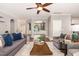 Comfortable living room with open archways, hardwood floors, and neutral colors at 6925 Rex Rd, Holly Springs, NC 27540