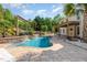 Backyard showcasing a sparkling pool, well-manicured landscaping, and a spacious patio area at 6925 Rex Rd, Holly Springs, NC 27540