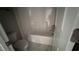 Neutral bathroom with tub/shower combination, toilet and neutral luxury vinyl tile flooring at 705 Blue Pointe Path, Apex, NC 27523