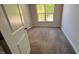 Carpeted bedroom with a window at 705 Blue Pointe Path, Apex, NC 27523