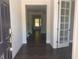 Foyer featuring dark hardwood floors and natural light at 705 Blue Pointe Path, Apex, NC 27523