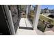 Cozy front porch with stone accents, iron railings, and supportive pillars offering a welcoming entrance at 705 Blue Pointe Path, Apex, NC 27523