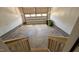 Spacious two-car garage with concrete flooring and a metal garage door at 705 Blue Pointe Path, Apex, NC 27523