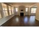 Living room featuring dark hardwood floors and natural light at 705 Blue Pointe Path, Apex, NC 27523