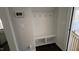 Mudroom with a built-in bench and shelving storage, and coat hooks at 705 Blue Pointe Path, Apex, NC 27523