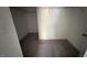 A view into a walk-in closet with wire shelving, neutral carpet and white walls with painted trim at 705 Blue Pointe Path, Apex, NC 27523