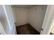 Spacious walk-in closet with ample storage space and custom shelving at 705 Blue Pointe Path, Apex, NC 27523