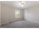 Bedroom featuring neutral walls, carpet, a window, and simple modern decor at 7104 Rex Rd, Holly Springs, NC 27540