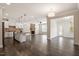 Spacious open floor plan features kitchen island, breakfast nook, and stone fireplace at 7104 Rex Rd, Holly Springs, NC 27540