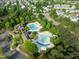 Aerial view features a community pool, clubhouse, manicured green spaces, and a well-planned neighborhood layout at 712 Portstewart Dr, Cary, NC 27519